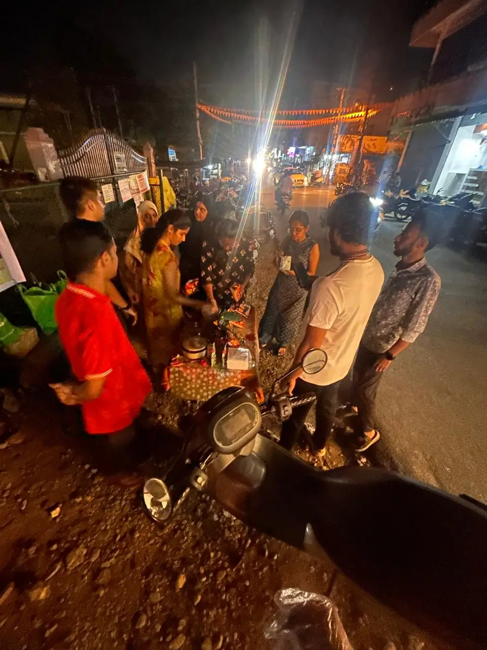 Customers gathered around a student's food stall