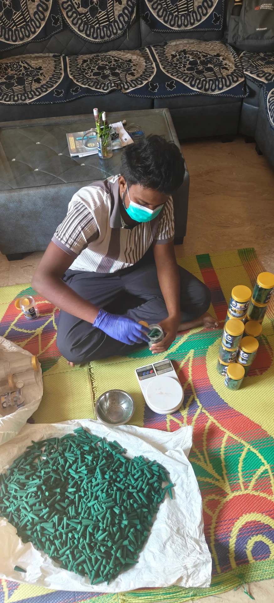 Student packing handmade products at home